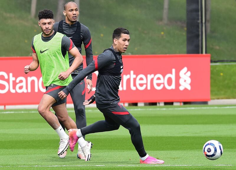 KIRKBY, ENGLAND - APRIL 28:(THE SUN OIUT. THE SUN ON SUNDAY OUT) Fabinho, Alex Oxlade-Chamberlain and Roberto Firmino of Liverpoolduring a training session at AXA Training Centre on April 28, 2021 in Kirkby, England. (Photo by John Powell/Liverpool FC via Getty Images)