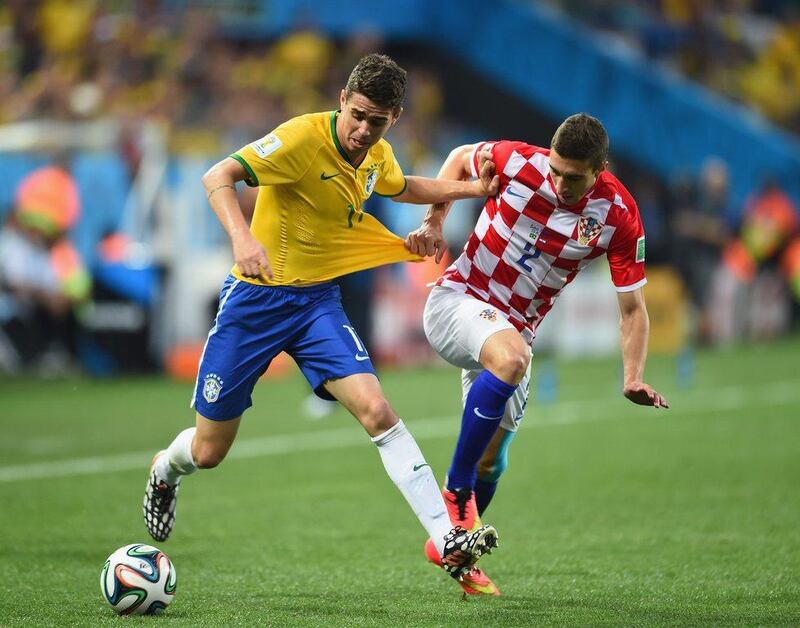 Oscar, left, of Brazil battles for the ball with Sime Vrsaljko, left, of Croatia during Thursday's World Cup opener at Arena Corinthians in Sao Paulo, Brazil. Buda Mendes / Getty Images