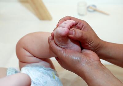 Abu Dhabi, United Arab Emirates - June 30, 2019: Arthur Cook who is 6 months old has hydrotherapy treatment and baby massage from Jacquelyn Pe–a at Baby Spa in Abu Dhabi. Sunday the 30th of June 2019. Yes Mall, Abu Dhabi. Chris Whiteoak / The National