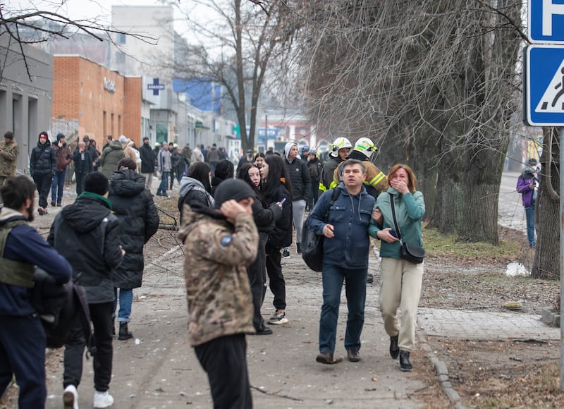 People gather in the city of Dnipro following the attack. EPA