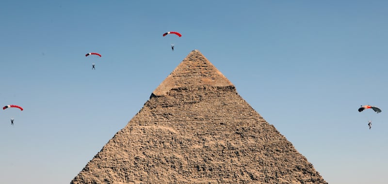 Skydivers fly over the Great Pyramids during the Egypt Air Sports Festival in Giza.