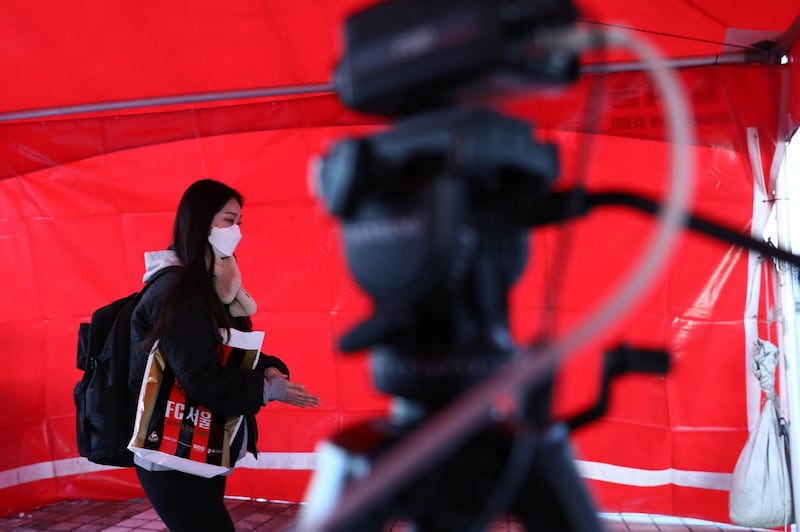 A football fan walks past a thermal camera used to detect signs of the corona virus ahead of the AFC Champions League Group E match between FC Seoul and Melbourne Victory. Getty Images