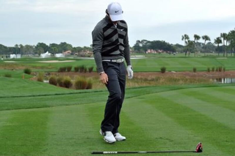 Rory McIlroy considers his club during his abortive second round at the Honda Classic in Florida.