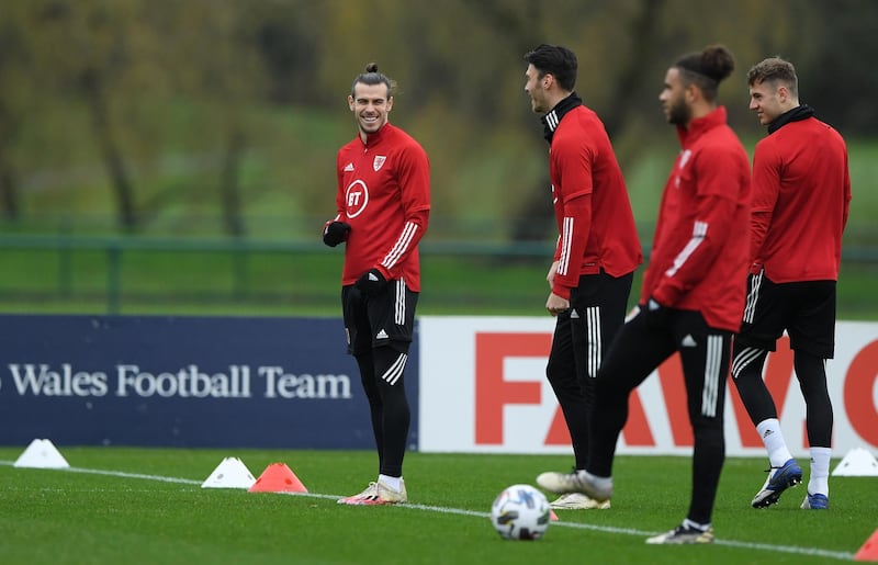 Wales captain Gareth Bale, left, shares a joke with Kieffer Moore. Getty