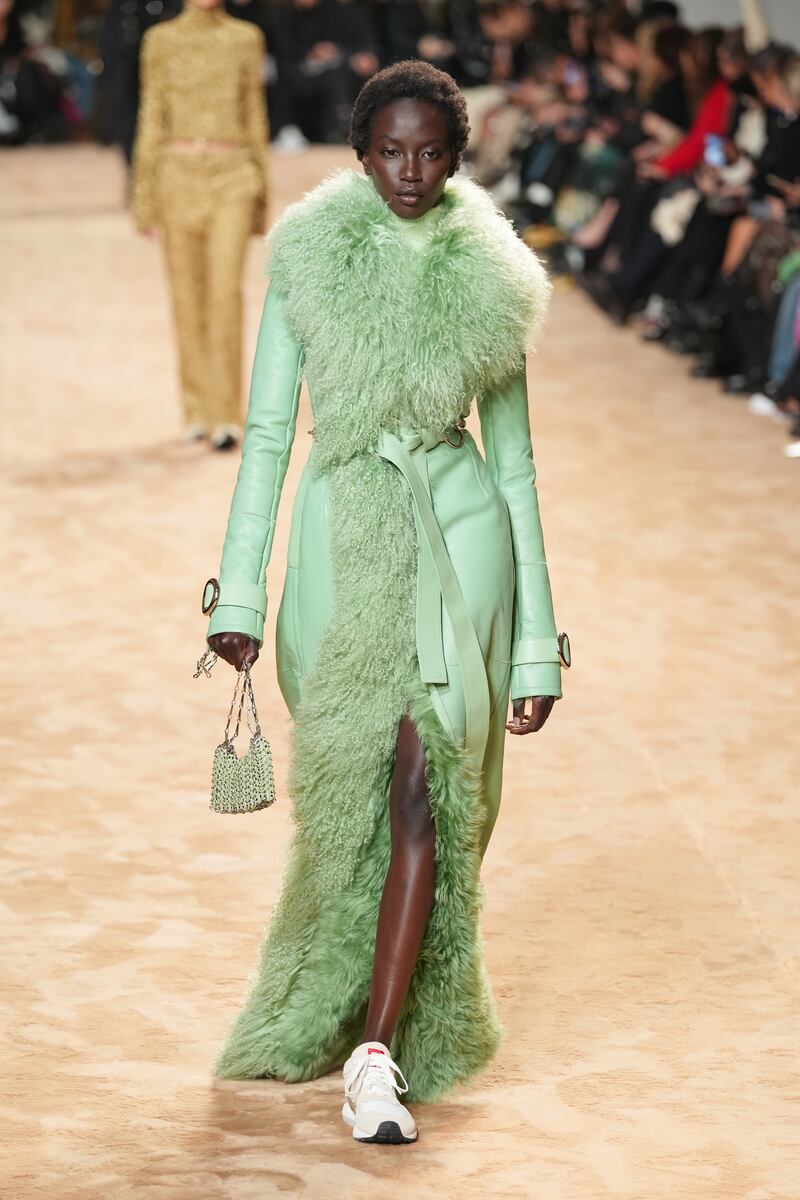 A pistachio leather coat with Mongolian lamb fur lining at Paco Rabanne for autumn/winter 2023. Getty