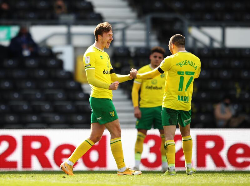 DERBY, ENGLAND - APRIL 10: Kieran Dowell of Norwich City  celebrates with Emi Buendia after scoring their team's first goal  during the Sky Bet Championship match between Derby County and Norwich City at Pride Park Stadium on April 10, 2021 in Derby, England. Sporting stadiums around the UK remain under strict restrictions due to the Coronavirus Pandemic as Government social distancing laws prohibit fans inside venues resulting in games being played behind closed doors.  (Photo by Alex Pantling/Getty Images)