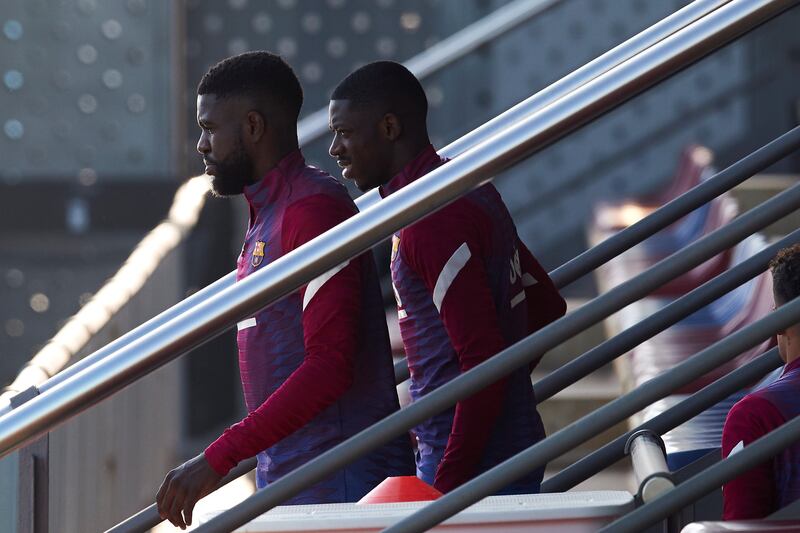 Barcelona's Samuel Umtiti, left, and midfielder Osmane Dembele during a training session at Joan Gamper Sports City. EPA