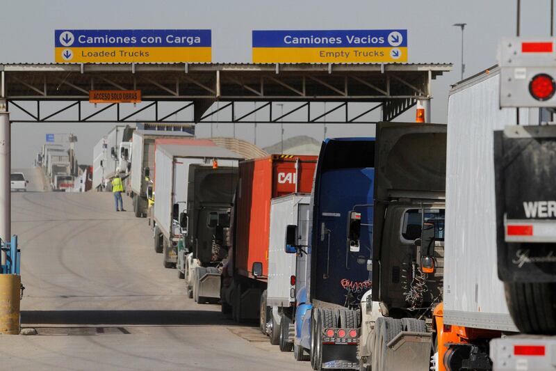 FILE PHOTO - Trucks wait in a long queue for border customs control to cross into the U.S. at the Otay border crossing in Tijuana, Mexico, February 2, 2017. REUTERS/Jorge Duenes/File Photo