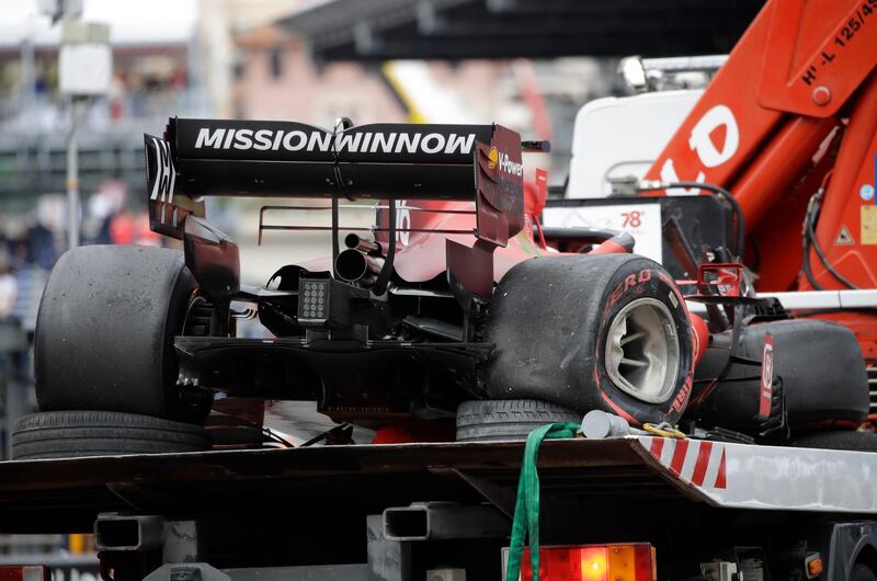 The car of Ferrari driver Charles Leclerc is taken off the track after a crash during the qualifying session. AP