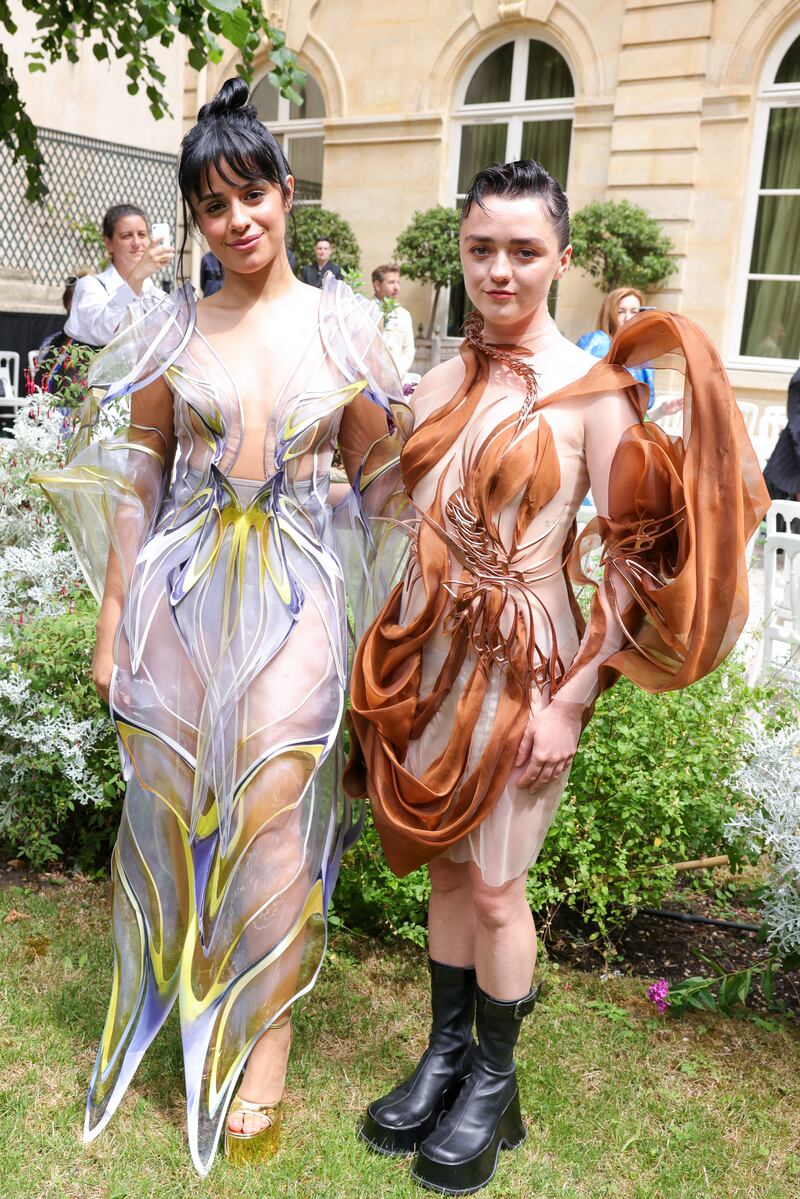 Maisie Williams and Camila Cabello at the Iris Van Herpen show. Getty