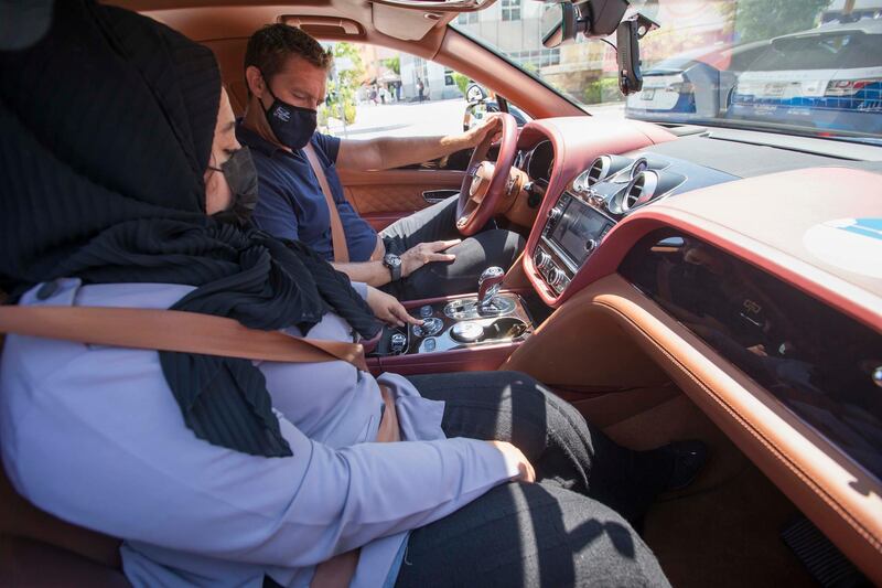 Dubai, United Arab Emirates - Driving instructor Zubeida inside a Bentley car instructing Nick Webster at the Emirates Driving Institute, Dubai.  Leslie Pableo for The National