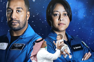 A Saudi man interacts with his daughter before the launch of a SpaceX Falcon 9 and Dragon capsule, part of Axiom Mission 2 (Ax-2), carrying four astronauts, two of whom are Saudi nationals, to the International Space Station, from Kennedy Space Centre, Florida, US, at an event to celebrate the first Saudi woman into Space in Riyadh, on May 21. Reuters