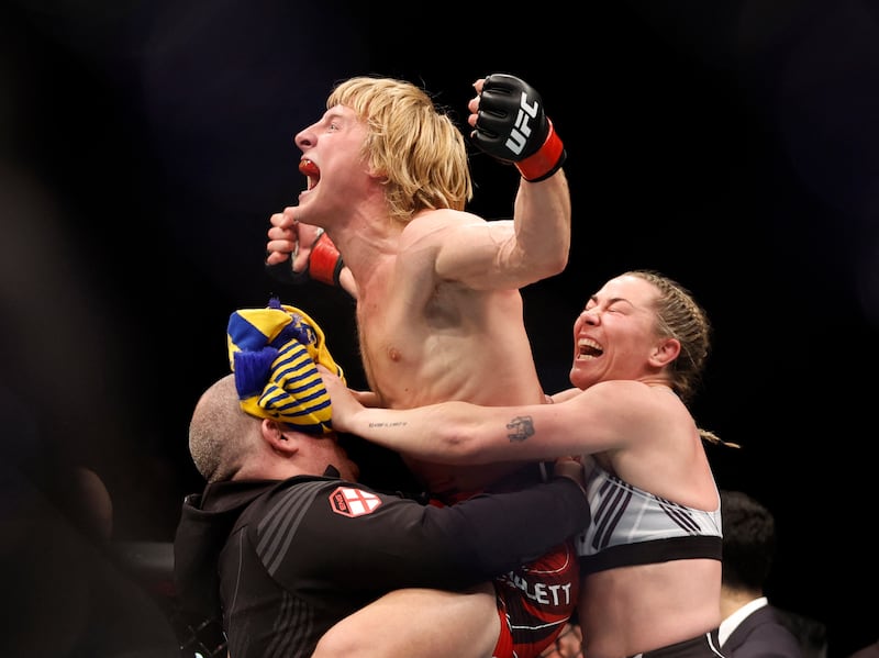 Paddy Pimblett celebrates winning his fight against Kazula Vargas with Molly McCan. Reuters
