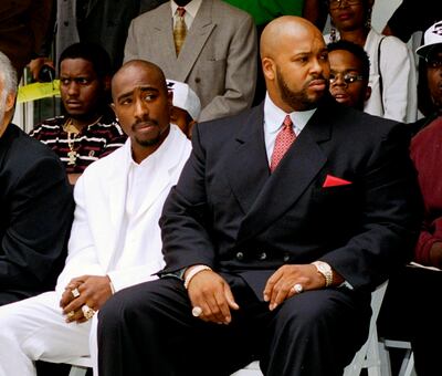 Tupac Shakur, left, and Death Row Records chairman Marion 'Suge' Knight at a voter registration event in Los Angeles in 1996. AP file