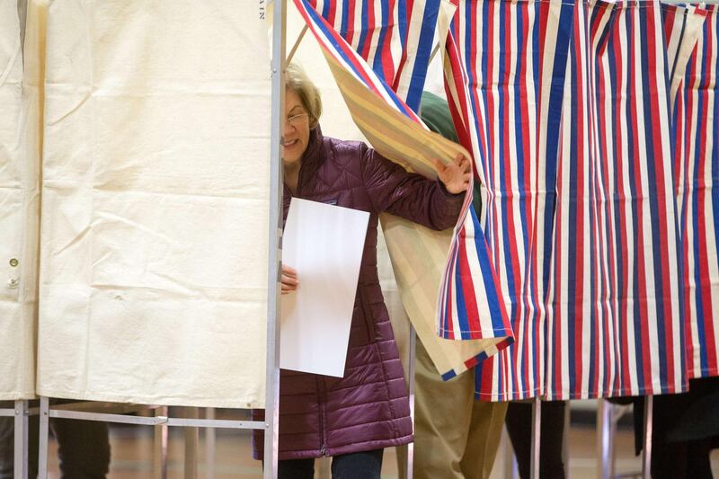 Senator Elizabeth Warren leaves the voting booth at the Graham & Parks School in Cambridge, Massachusetts. AFP