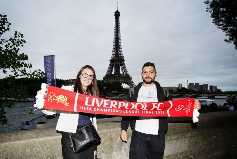 Liverpool fans pose in front of the Eiffel Tower in Paris. PA