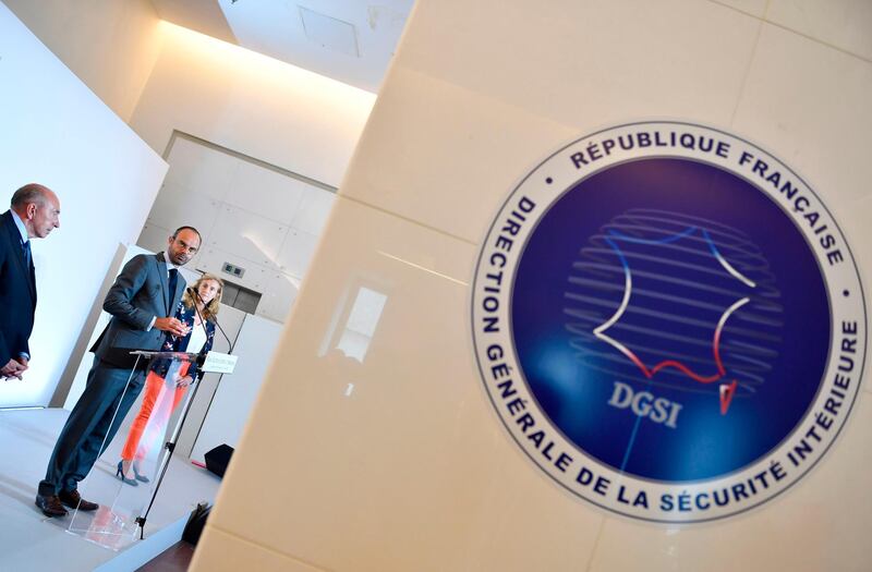 French prime minister Edouard Philippe is flanked by minister of the interior Gerard Collomb, left, and French justice minister Nicole Belloubet in Paris, France. Gerard Julien / AFP