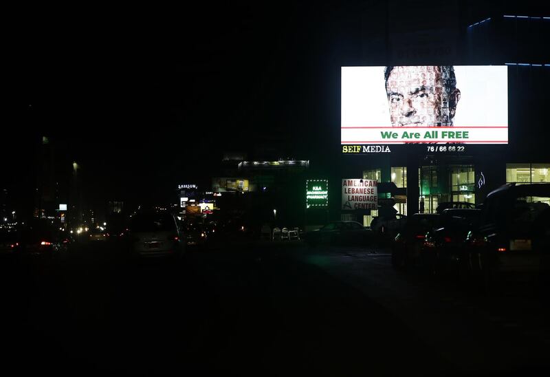 A billboard displaying a portrait of Former Nissan chairman Carlos Ghosn, on the Dbayeh highway, north of the Lebanese capital Beirut. AFP