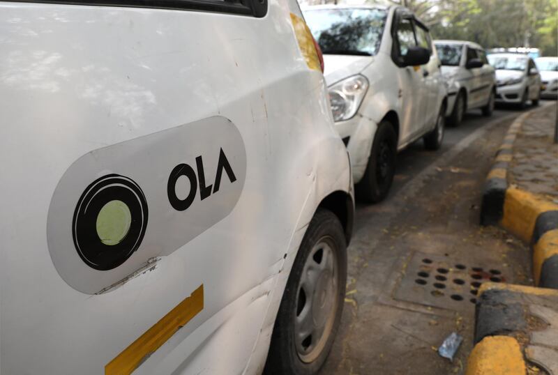 epa06620194 App-based taxis park during a protest against Ola and Uber companies in New Delhi, India, 22 March 2018. Reports stated that Uber and Ola drivers in New Delhi staged protest to demand better pay and working conditions.  EPA/RAJAT GUPTA