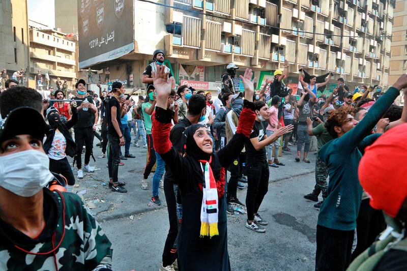 Anti-government protesters gather in Baghdad, Iraq, Wednesday, Nov. 13, 2019. Protesters say an intensifying crackdown by Iraqi authorities is instilling fears but remain defiant with calls for millions to return to the streets this week. (AP Photo/Hadi Mizban)