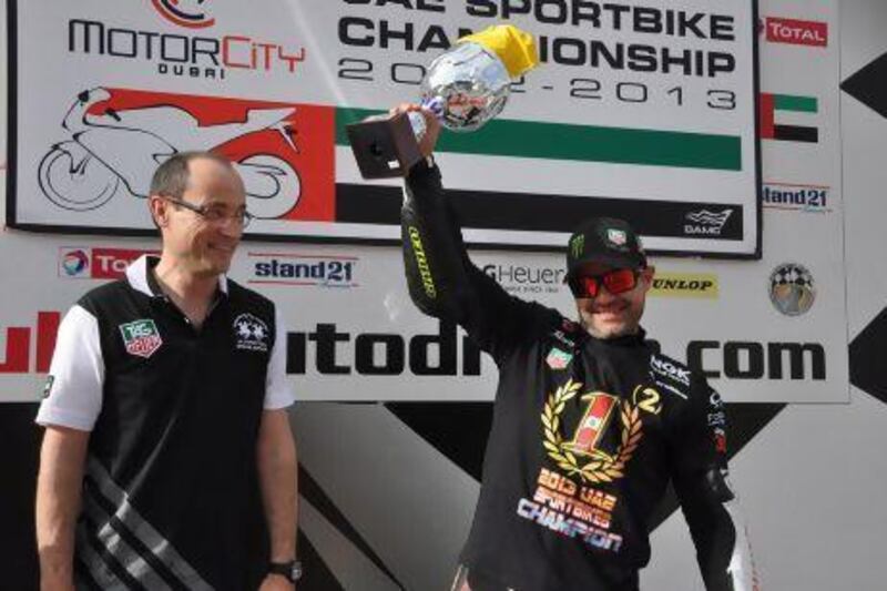 Motorcity UAE Sportbikes champion Mahmoud Tannir celebrates on the podium with Luc Decroix, General Manager TAG Heuer Middle East.