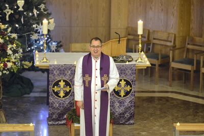  Abu Dhabi, United Arab Emirates -  Reverend Andrew Thompson lead the Christmas mass service, which marks the 60th anniversary of the first Anglican service in Abu Dhabi in December 1957, and was commemorated on December 17, 2017 at St. Andrews Church. (Khushnum Bhandari/ The National) 
