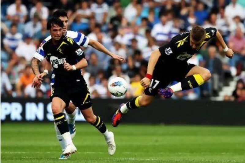 Ivan Klasnic, right, of Bolton controls the ball as teammate Chris Eagles looks on against Queens Park Rangers at Loftus Road.