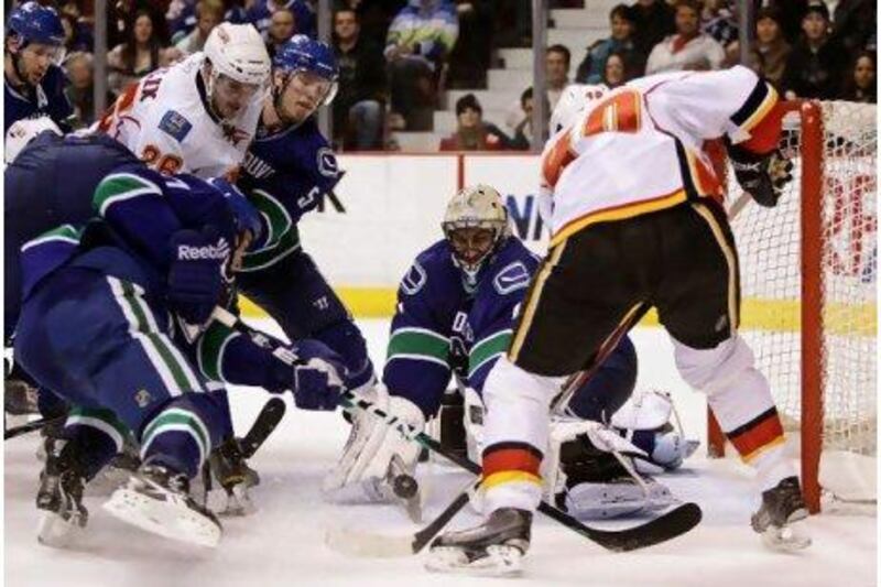 Roberto Luongo, centre, has been a pillar in Vancouver Canucks' success this season. Darryl Dyck / AP Photo