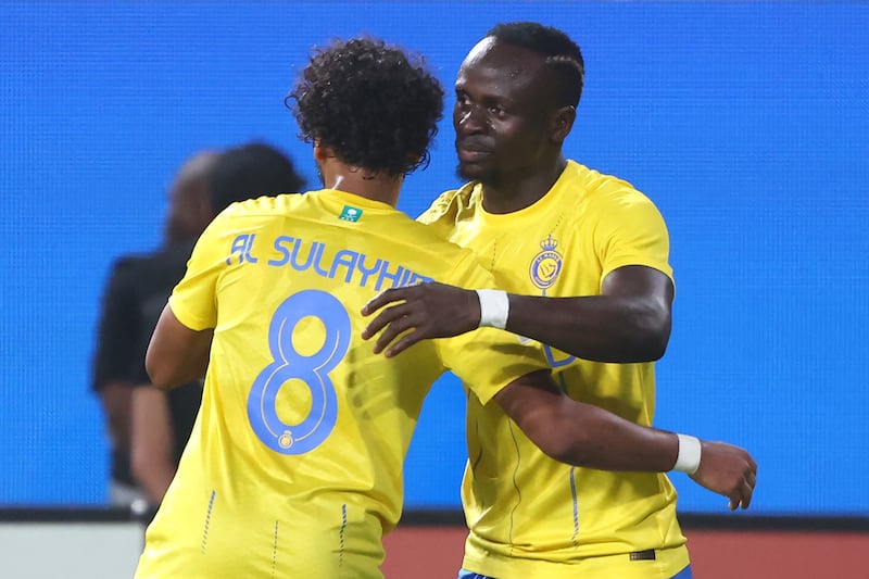 Sadio Mane celebrates with Abdulmajeed Al Sulayhem after scoring Al Nassr's second goal. AFP