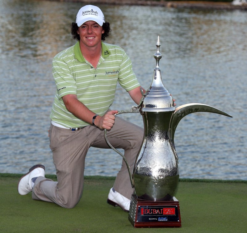 DUBAI, UNITED ARAB EMIRATES - FEBRUARY 01:  Rory McIlroy of Northern Ireland poses with the winners trophy after the final round of the Dubai Desert Classic played on the Majlis Course on February 1, 2009 in Dubai,United Arab Emirates.  (Photo by Ross Kinnaird/Getty Images)