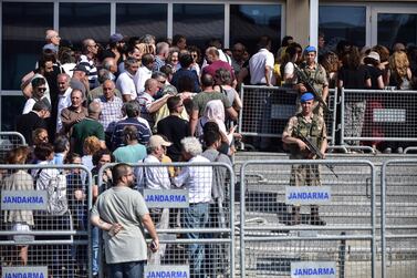Turkish soldiers stand outside the court in June in a prison complex where the trial of prominent philanthropist Osman Kavala and 15 others began. AP