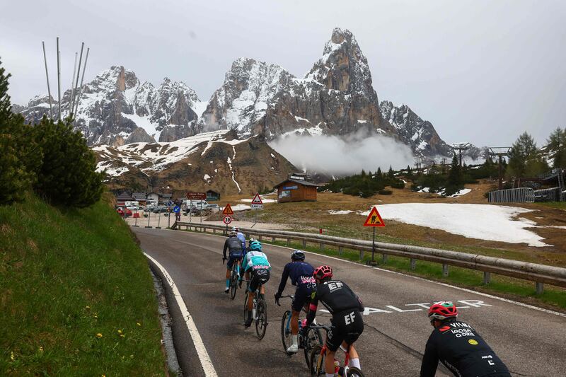 The pack rides in Passo Rolle during Stage 17. AFP