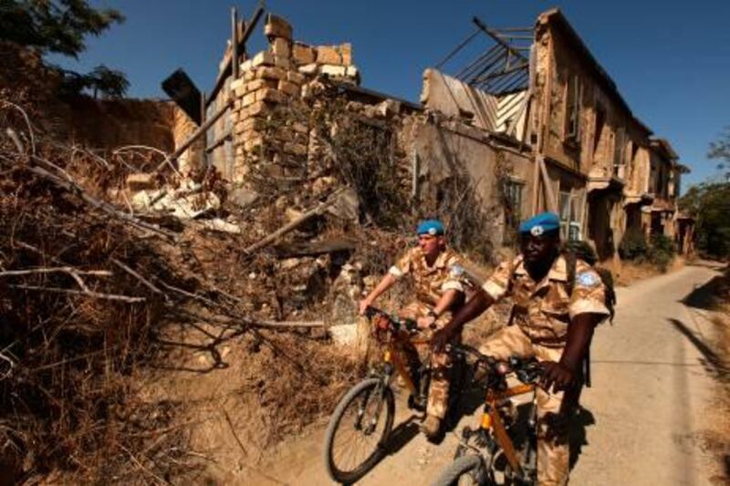 TO GO WITH AFP STORY BY SONIA WOLF
British UN soldiers patrol the green line separating the divided Cypriot capital of Nicosia on October 16, 2009. In the buffer zone of "no man's land" in Nicosia, all that remains are the shells of once-sumptuous houses, long ago invaded by nature in the form of cacti or fig and olive trees. AFP PHOTO/PATRICK BAZ