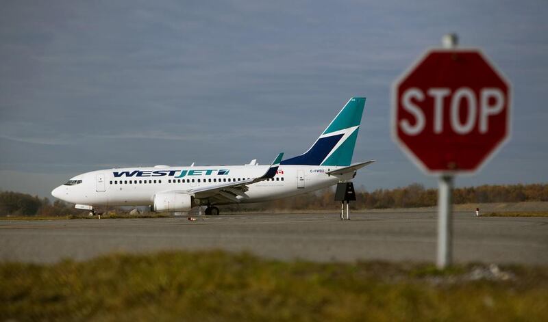 A Westjet aircraft taxis at Vancouver International Airport in Canada