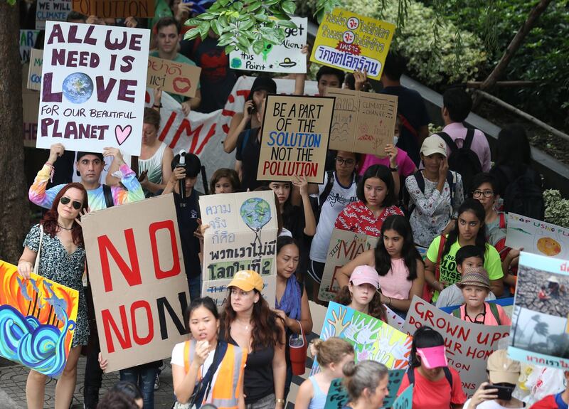 People march toward the Ministry of Natural Resources and Environment in Bangkok. EPA