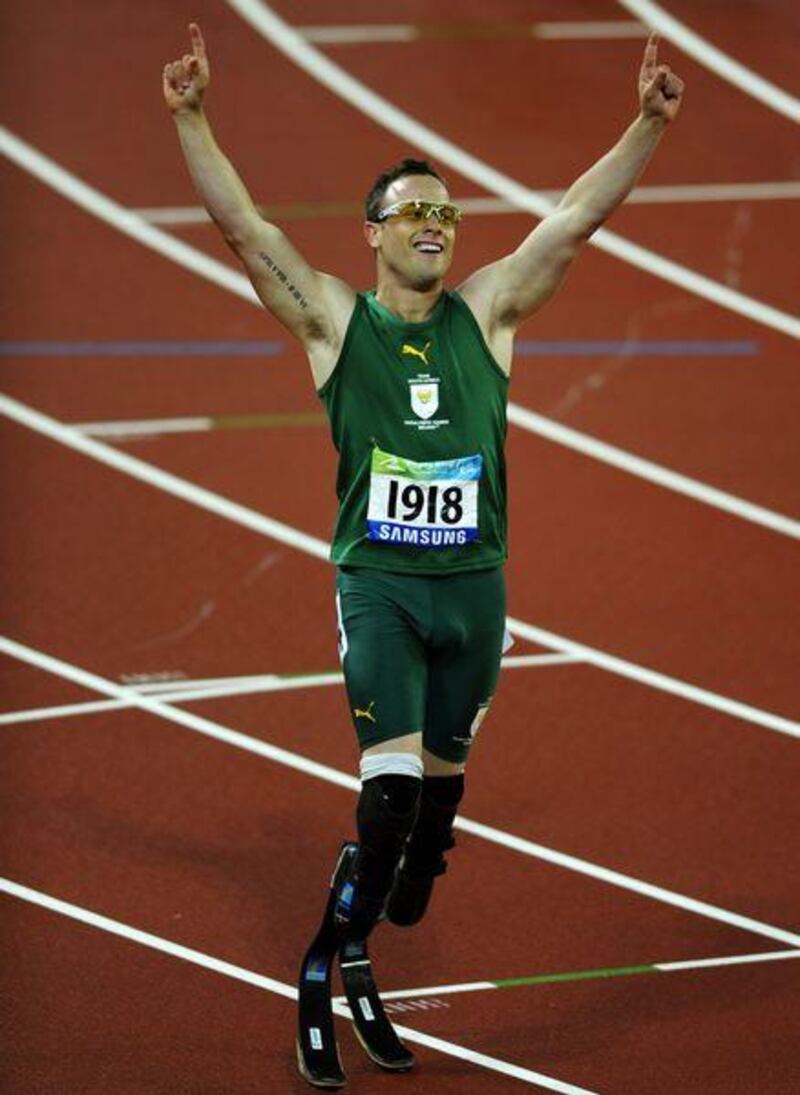 Oscar Pistorius celebrates after winning gold in the men's 400 metres at the Beijing Paralympic Games.