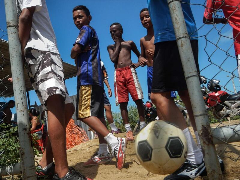 "The Cidade de Deus may have been 'pacified' but that did not make it a trouble-free area. More than once we found ourselves face to face with drug dealers who were not exactly pleased to see all these cameras. But thanks to Tony's timely interventions, none of these situations ever turned bad." Joyce Nascimento / AFP