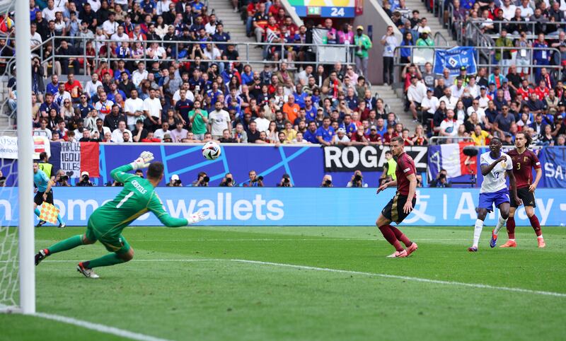 Randal Kolo Muani's deflected shot beats Belgium keeper Koen Casteels. Getty Images