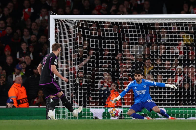 Harry Kane shoots and scores a penalty to give Bayern a 2-1 lead against Arsenal. AFP