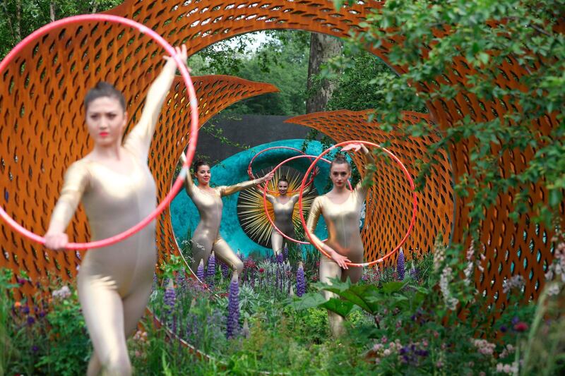 Dancers perform in The David Harber and Savills Garden at the 2018 Chelsea Flower Show in London.