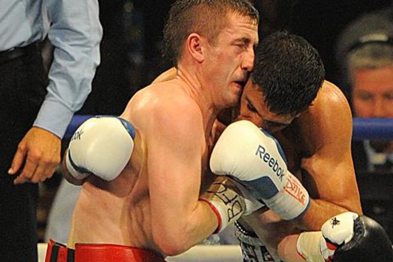 Amir Khan and Paul McCloskey clash heads resulting in a cut for McCloskey and the referee stopping the fight.