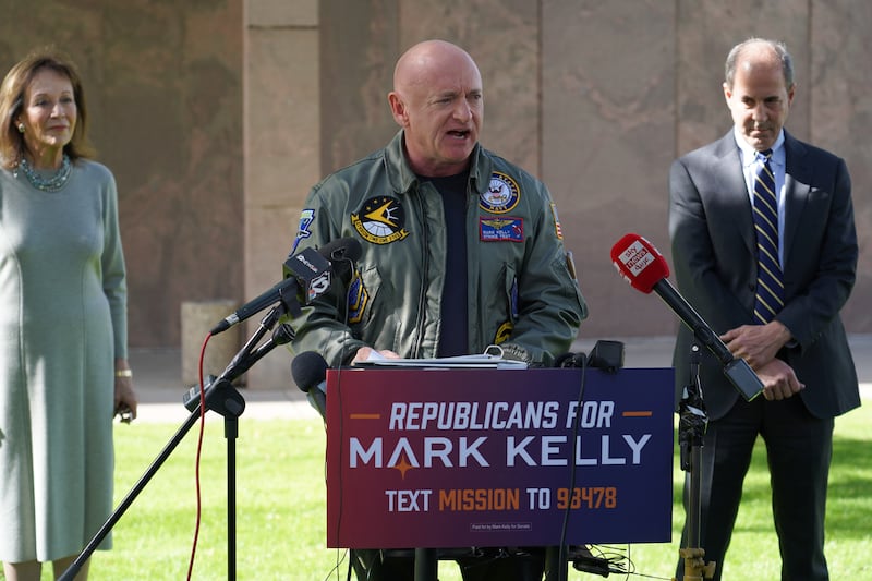 Democratic Senator Mark Kelly speaks at a campaign stop with Republicans who have endorsed him. Willy Lowry / The National