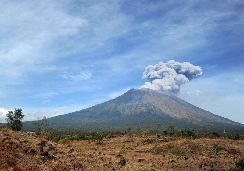 A plume of fresh ash is released as Mount Agung volcano erupts, in this image seen from the village of Tulamben in Karangasem Regency on Indonesia's resort island of Bali. Sonny Tumbelaka / AFP