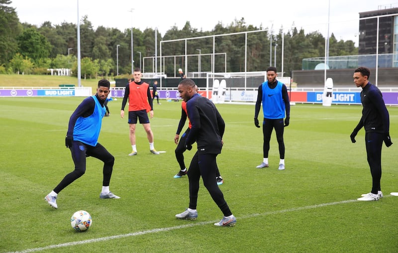 BURTON-UPON-TRENT, ENGLAND - JUNE 05:  Marcus Rashford and Raheem Sterling take part in an exercise during an England training session on the eve of their UEFA Nations League match against the Netherlands at St Georges Park on June 05, 2019 in Burton-upon-Trent, England. (Photo by Marc Atkins/Getty Images)