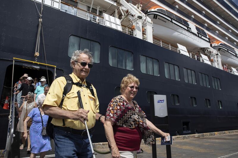 Passengers disembark the MS Westerdam cruise ship docked in Sihanoukville, Cambodia. Getty Images