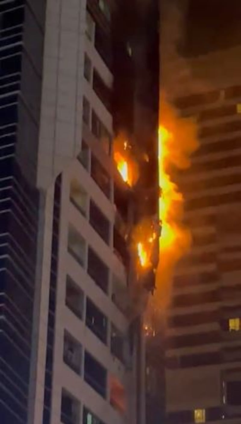 Flames pour from the upper floor balconies in this footage shot by an eyewitness
