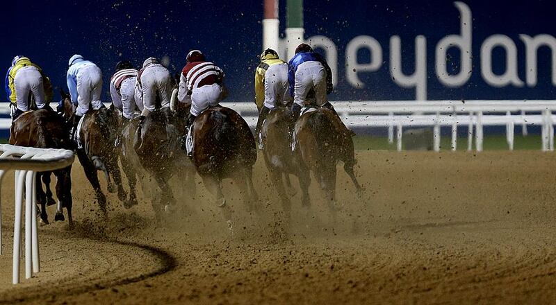 Horses race along Meydan Racecourse's dirt track in Dubai last month. The Dubai World Cup will be ran on the surface on Saturday, March 28. Satish Kumar / The National / February 28, 2015 