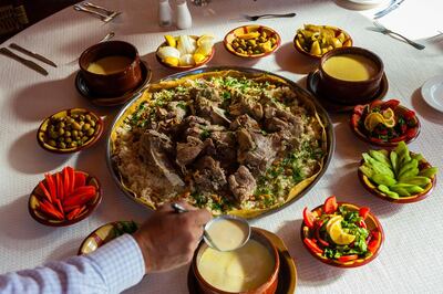 Mansaf consists of lightly spiced marinated lamb or chicken simmered in a yogurt-based sauce. Photo: Blaine Harrington III / Alamy Stock Photo