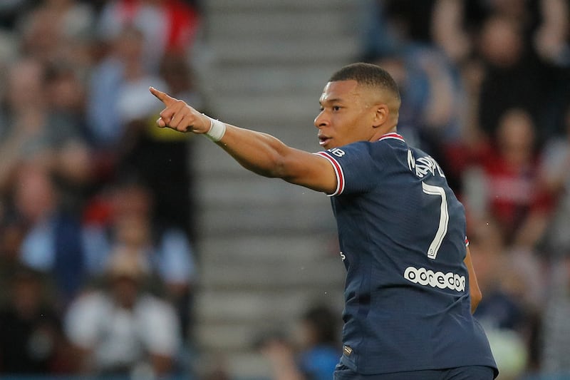 Mbappe celebrates after scoring his first goal. AP