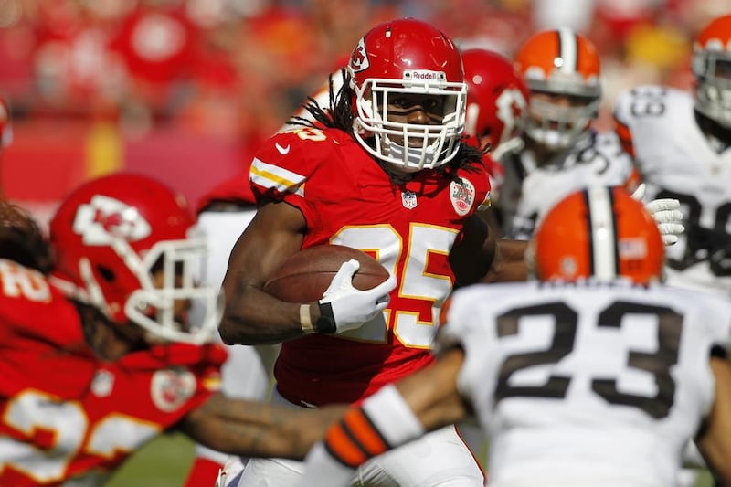Jamaal Charles, centre, carries the load on the ground and through the air for Kansas City Chiefs. Colin E. Braley / AP Photo